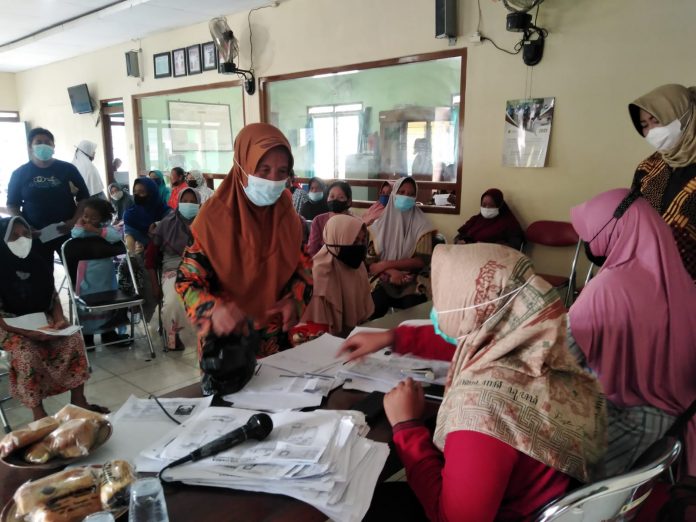 Ilustrasi penyaluran bantuan sosial (Bansos) dari pemerintah