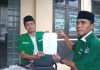 Ketua LBH Ansor Pati, Luqmanul Hakim (kanan) Ketua Cabang Gerakan Pemuda (GP) Ansor Pati, Syafiq Abdullah Muadz (kiri) saat di Polresta Pati, Senin (7/11/2022)